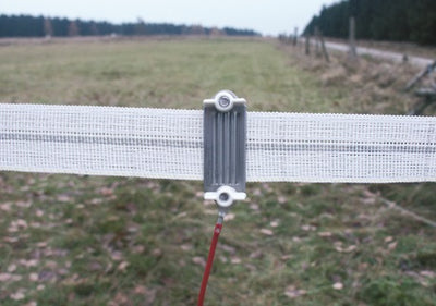 Connectors for electric fence tape