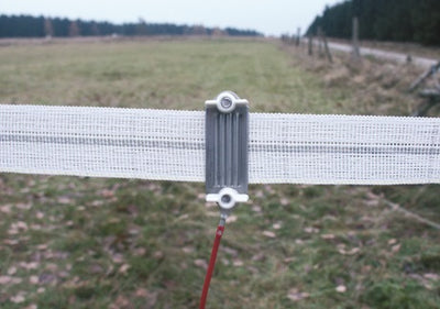 Connectors for electric fence tape